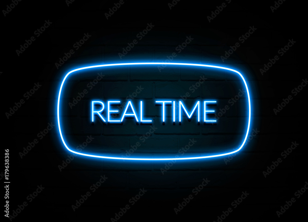Real Time  - colorful Neon Sign on brickwall