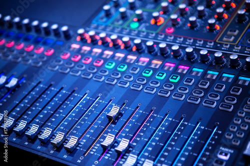 Professional sound and audio mixer control panel with buttons and sliders