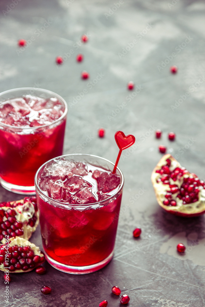 Pomegranat juice with ice and fruit slices, copy space Pomegranat juice with ice and fruit slices, copy space