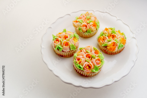 Top view decorated cupcakes on white Background.