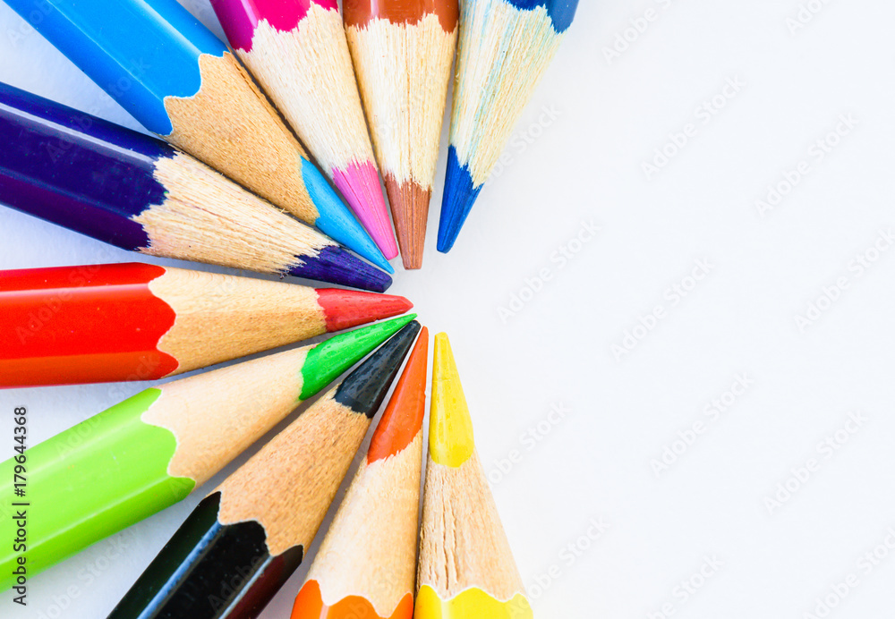 Fototapeta premium Closeup different colored pencils on white background.