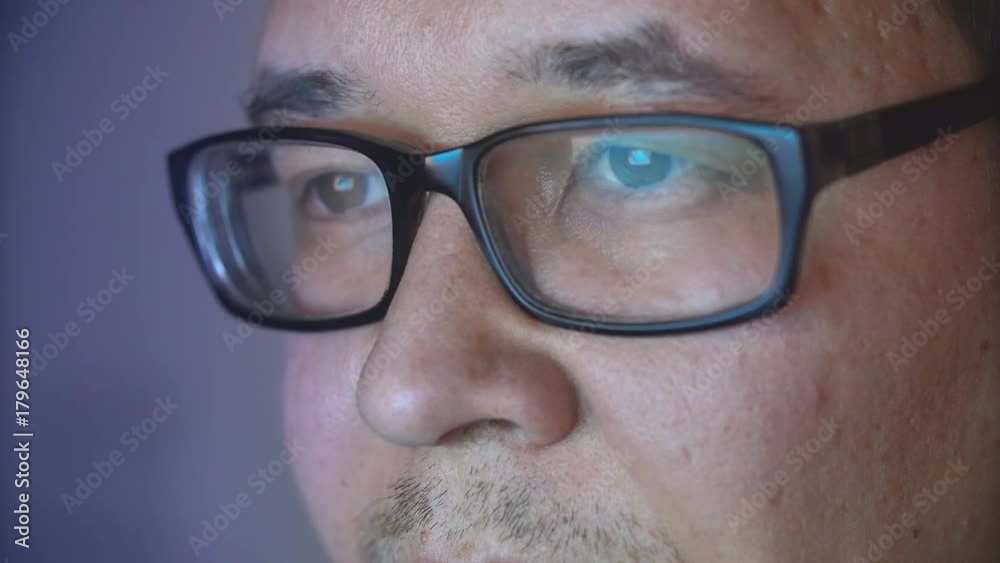 Hacker Using Computer at Night, Screen Reflection. Hidden man using computer at night. Hacker Using Computer at Night, Screen Reflection. Hidden man using computer at night.