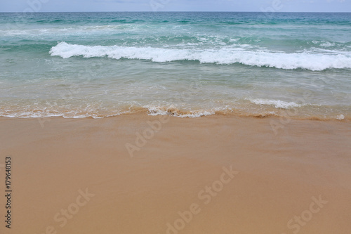 Landscape view of sea wave on the beach sand.