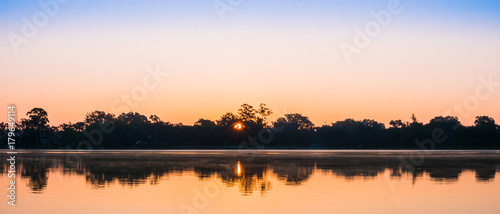 The panoramic silhouette landscape of lake at Pindaya town  Myanmar in the morning time with the sunrise and the mirror lake