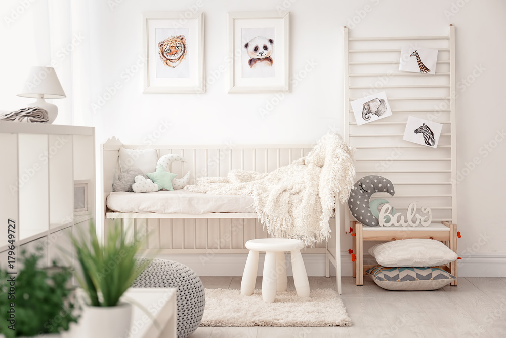 Obraz premium Baby bedroom decorated with pictures of animals