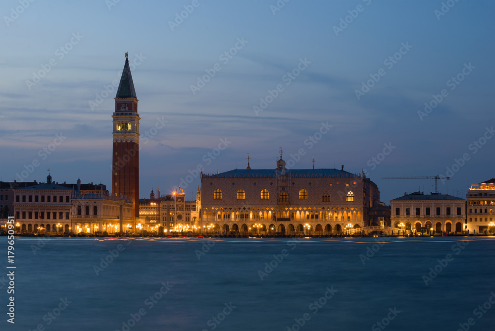 The historical center of Venice in the evening twilight. View of the Doge's Palace and the Campanile of St. Mark's Cathedral. Italy