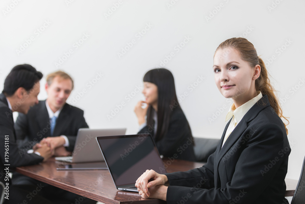 Caucasian businesswoman in meeting room. Caucasian businesswoman in meeting room.