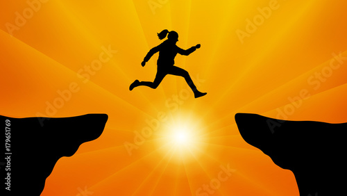 Silhouette the girl jumping over the gap at sunset. Jump from the cliff