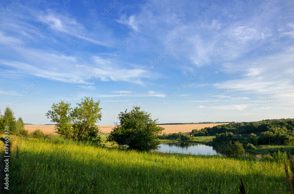 Sunny summer landscape.River Krasivaya in Tula region,Russia.Sunset.