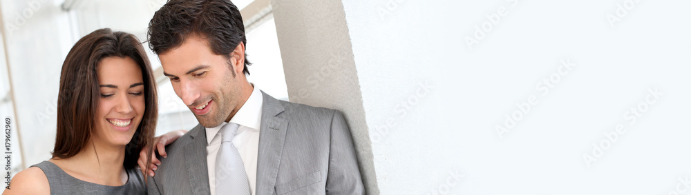 Business partners working in hall on electronic tablet - banner template web Business partners working in hall on electronic tablet - banner template web