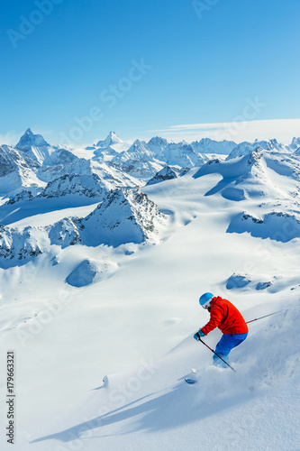 Skiing with amazing view of swiss famous mountains in beautiful winter snow Mt Fort. The matterhorn and the Dent d'Herens. In the foreground the Grand Desert glacier.