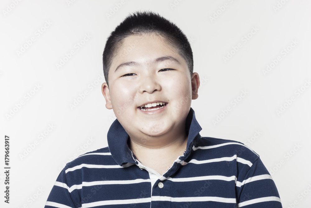 A fat boy portrait with smile isolated white. A fat boy portrait with smile isolated white.