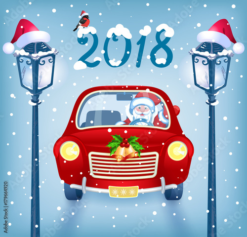  Santa Claus in red car with  inscription 2018 against snowfall background and lampposts