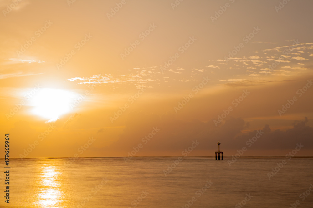 sunset on the beach with lighthouse