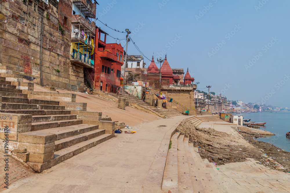 VARANASI, INDIA - OCTOBER 25, 2016: View of Ghats (riverfront steps) leading to the banks of the River Ganges in Varanasi, India VARANASI, INDIA - OCTOBER 25, 2016: View of Ghats (riverfront steps) leading to the banks of the River Ganges in Varanasi, India