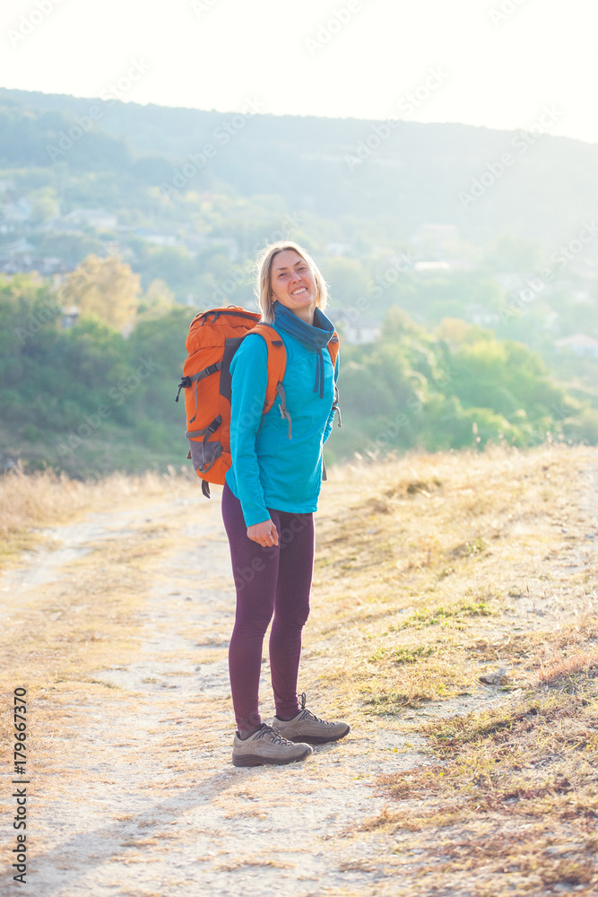 Fototapeta premium A girl with a backpack.