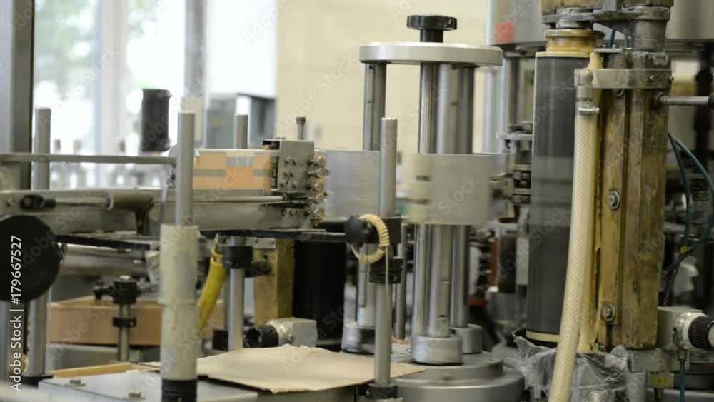 Automatic labeling machine during operation. Automatic labeling machine during operation.