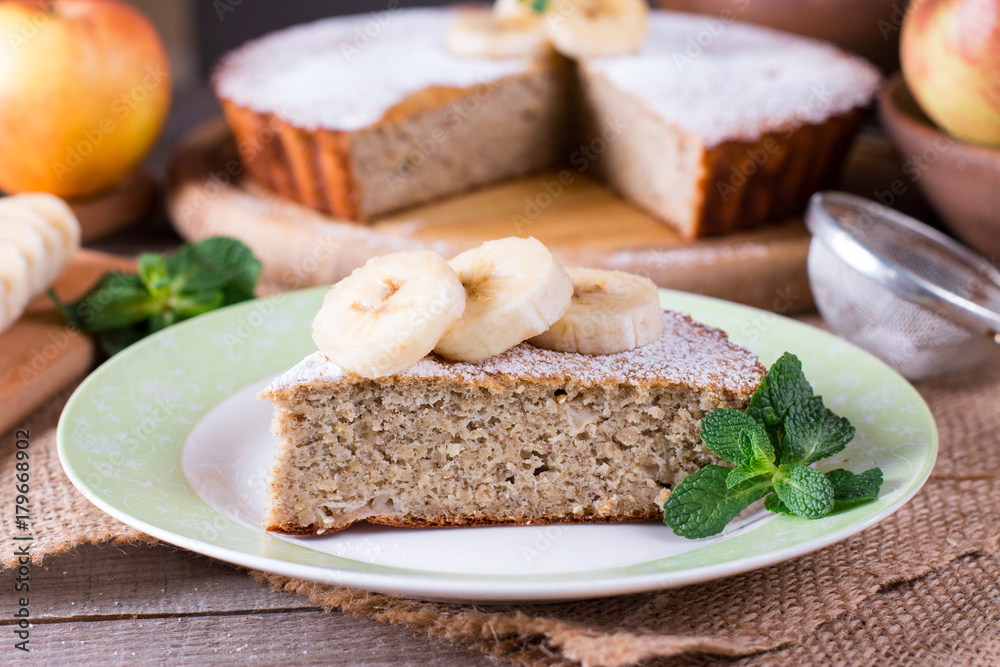 Slice of banana cake on a plate, selective focus Slice of banana cake on a plate, selective focus