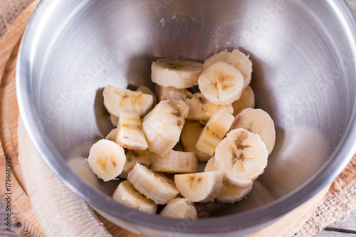 Sliced banana in a metal bowl