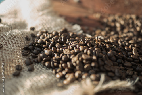 coffee beans on a table with burlap. photo