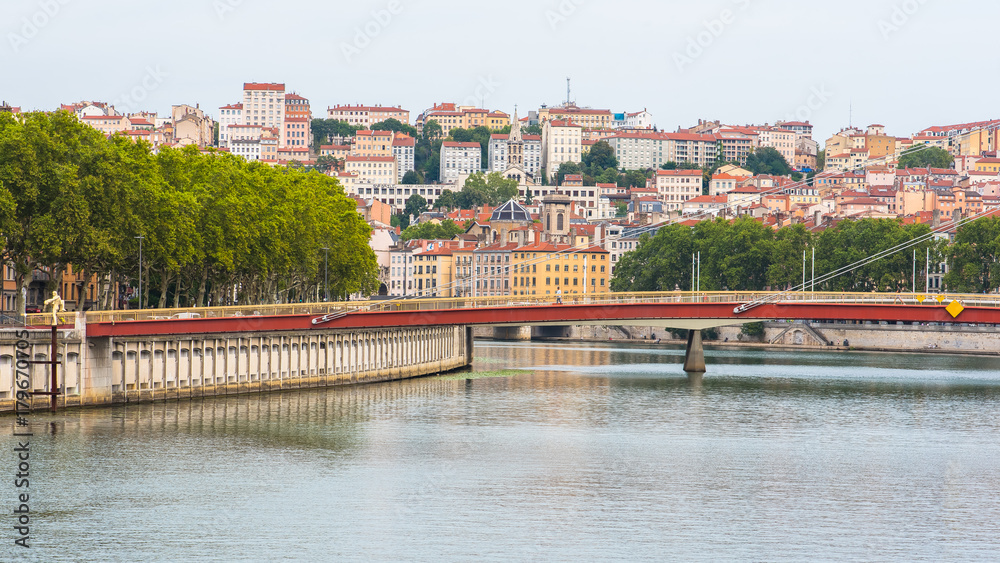Vieux-Lyon, colorful houses and footbridge in the center, on the river Saone 

