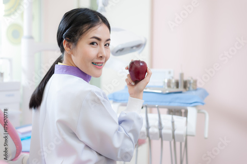 Female dentist crossing armin dental clinic