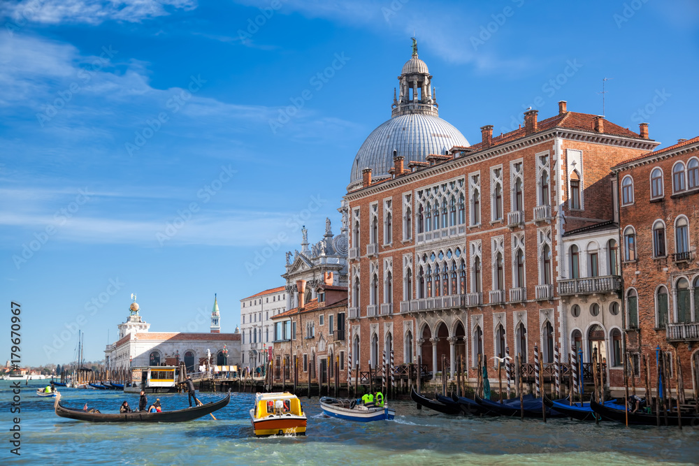Grand Canal with gondola and boats in Venice, Italy