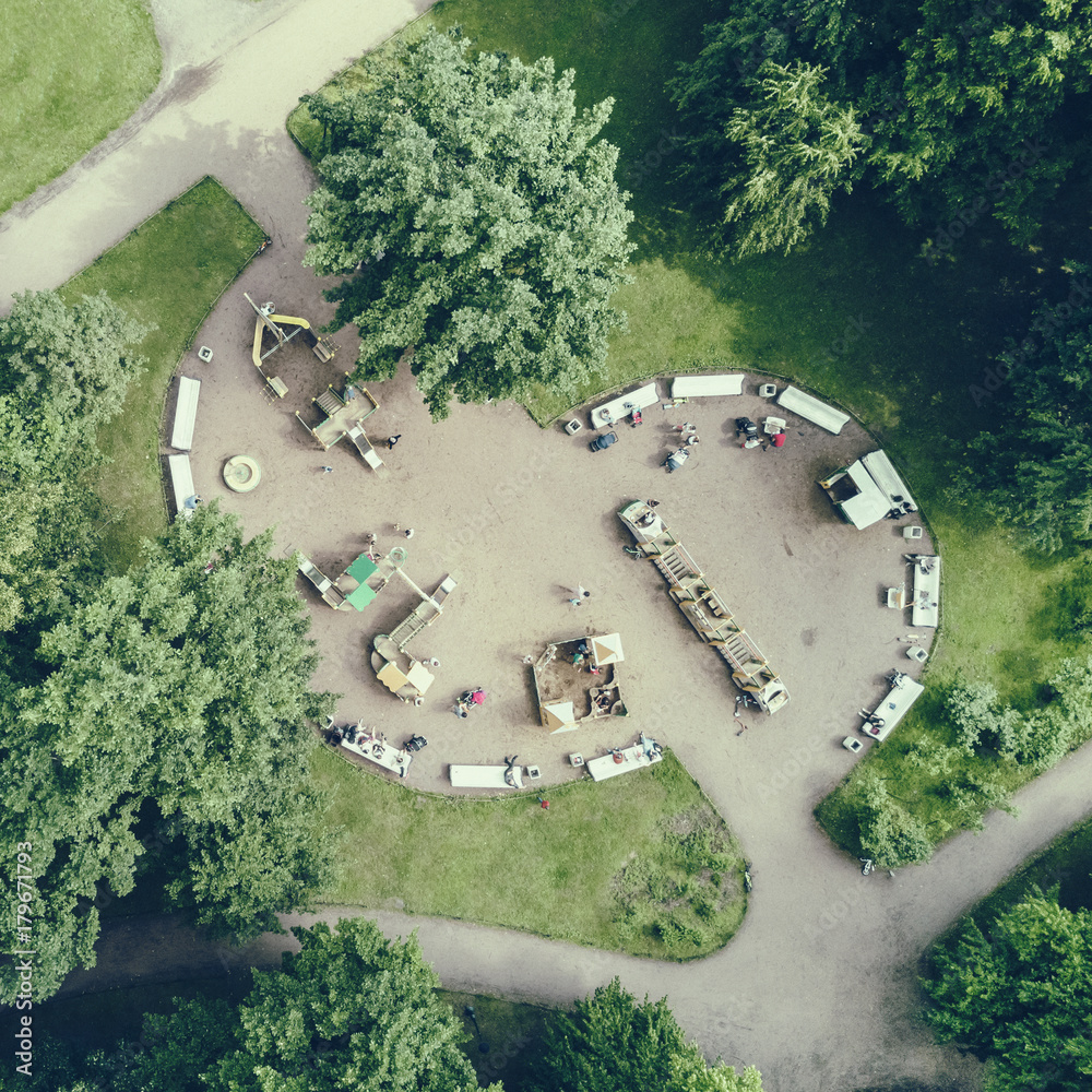 Top view of the people in the playground in the park. Toned