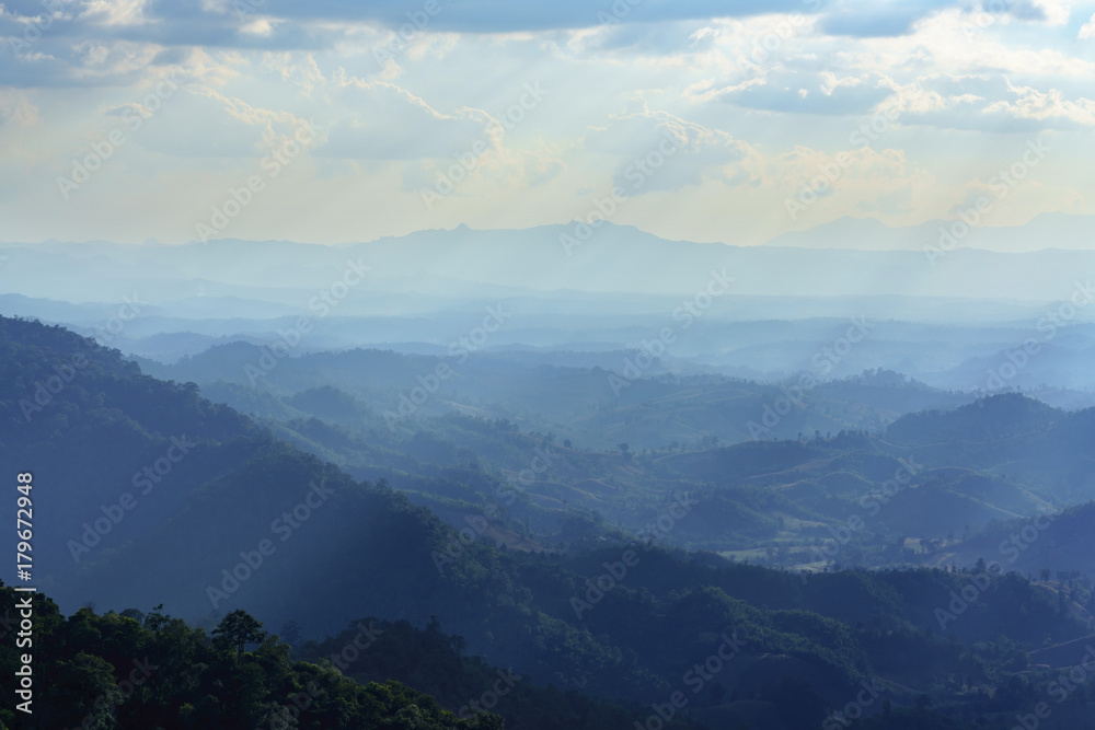 Beautiful scenery of mountains with light sunrays in the evening , Tak province , Thailand