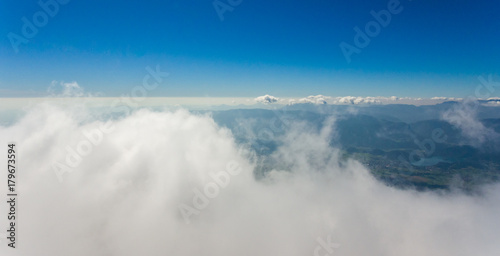 Aerial flying above clouds.
