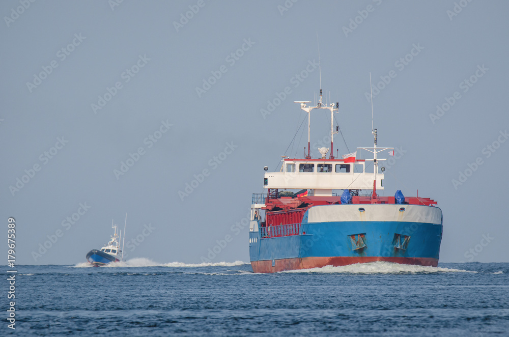 MERCHANT VESSEL - Freighter sailing on the sea MERCHANT VESSEL - Freighter sailing on the sea