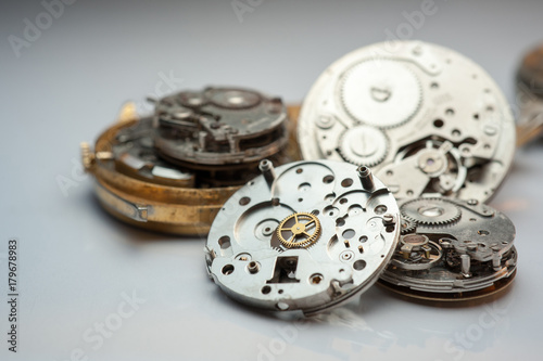 Detail of watch machinery on the table. 