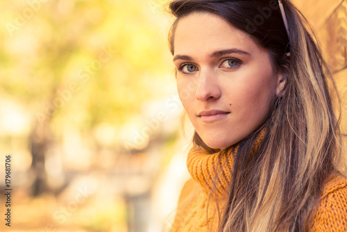 Portrait of young hipster girl in autumn park
