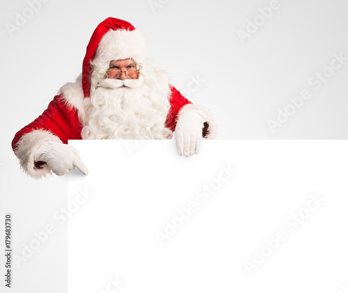 Santa Claus holding a large blank sign   © Tijana