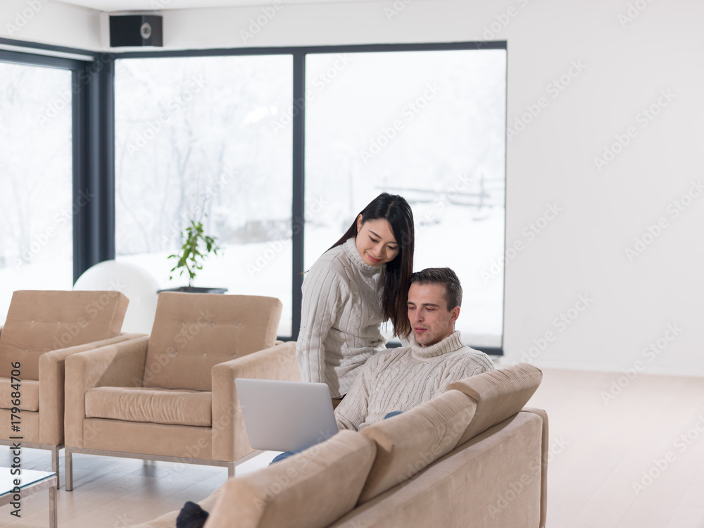 Fototapeta premium multiethnic couple using laptop computers