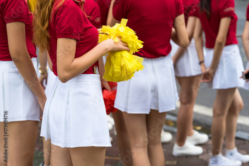 Young cheerleader group closeup with legs photo