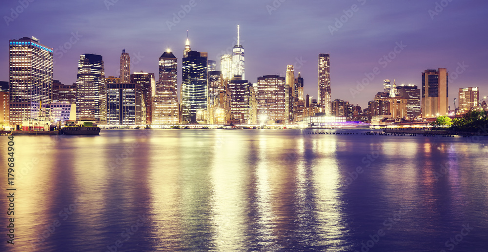 Fototapeta premium Vintage toned picture of New York City at night.