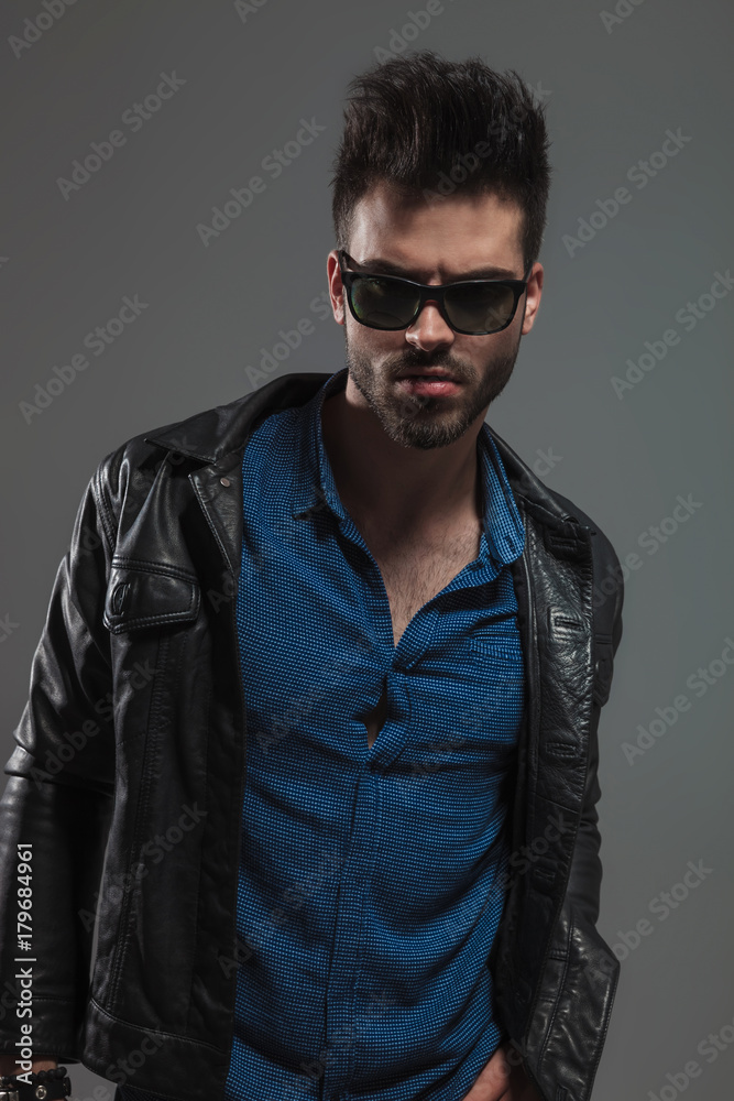 angry man in leather jacket and sunglasses angry man in leather jacket and sunglasses