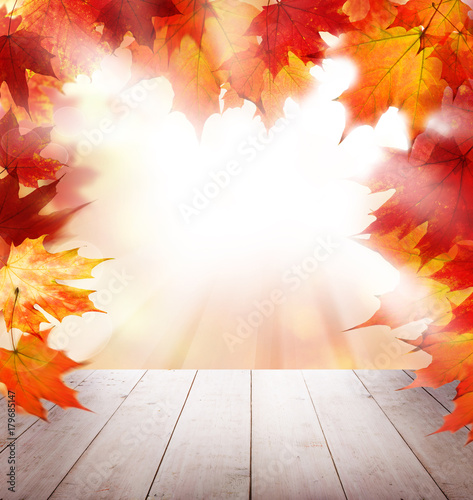 Red Autumn Maple Leaves  White Empty Wooden Table and Sunlight Outdoor. Fall Background Template Mock up for Autumn Product