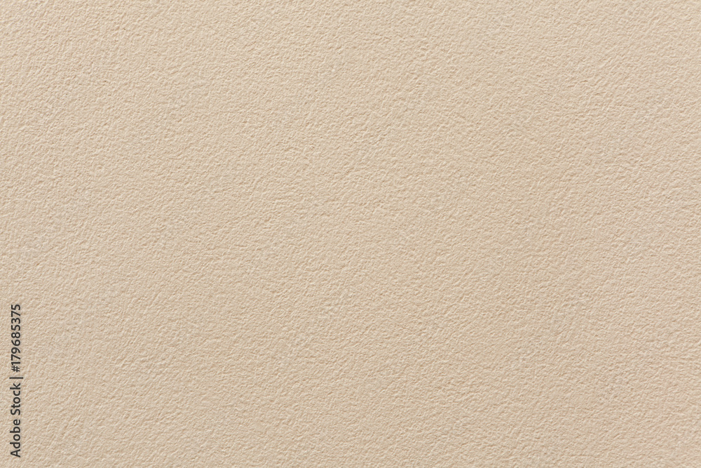 Beige painted stucco wall.