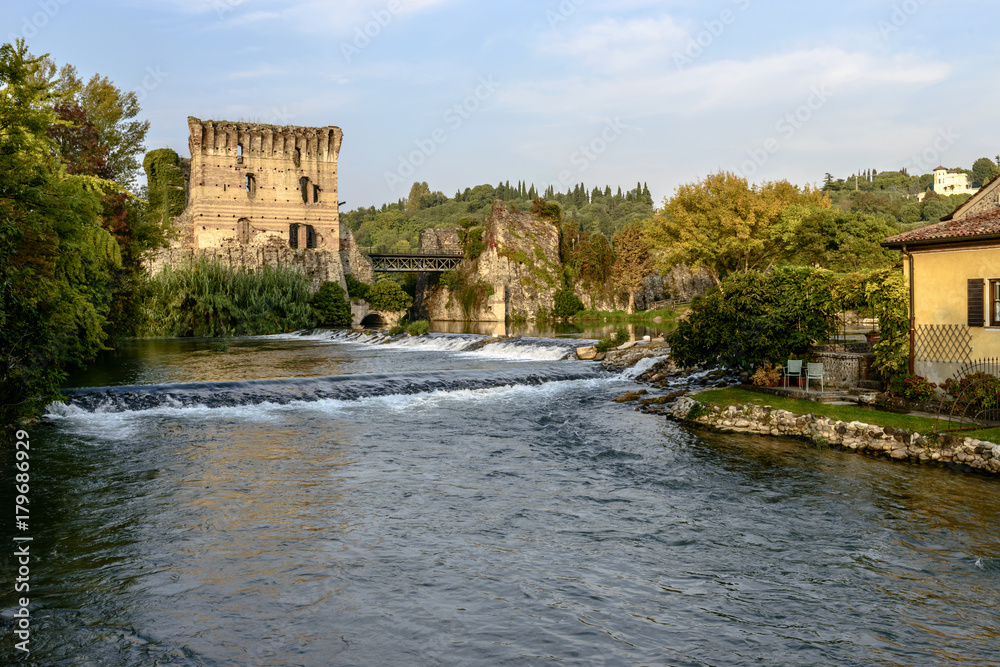 waterfalls and old bridge and Mincio river, Valeggio, Italy