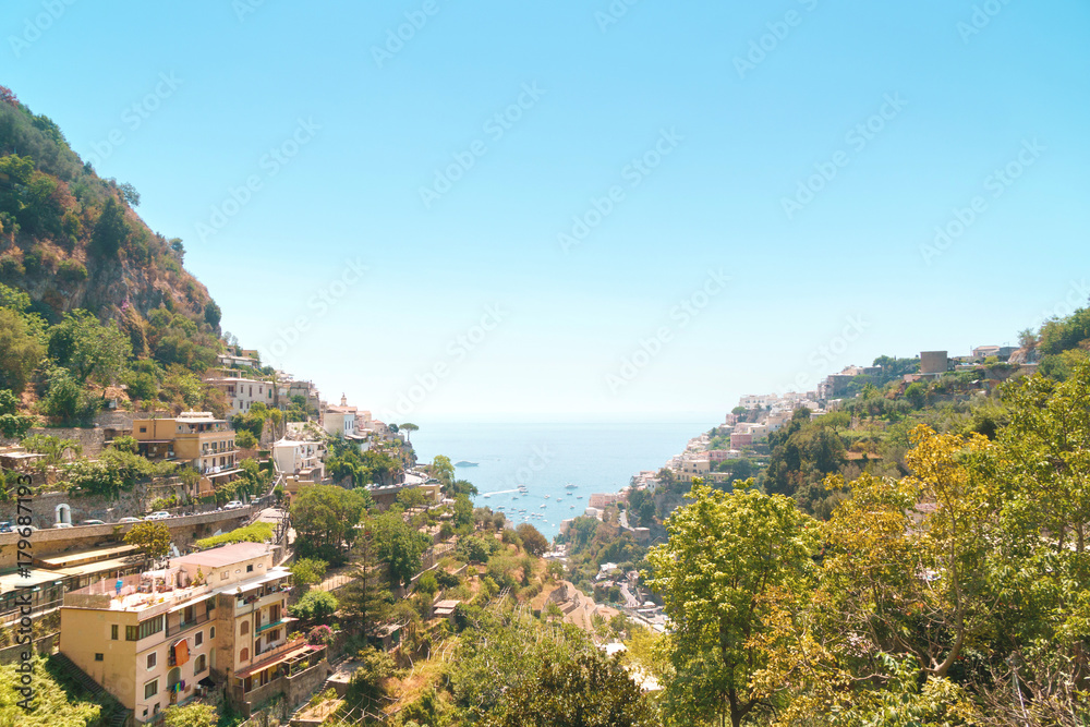 Positano on Sorrento coast with typical Campania province houses and sea on horizon.
