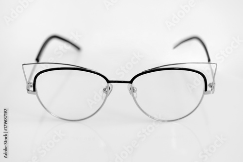 Eye glasses with clear lenses on the white background