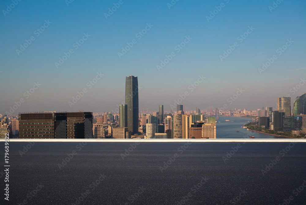 Empty road surface floor with city landmark buildings of Shanghai Skyline Empty road surface floor with city landmark buildings of Shanghai Skyline