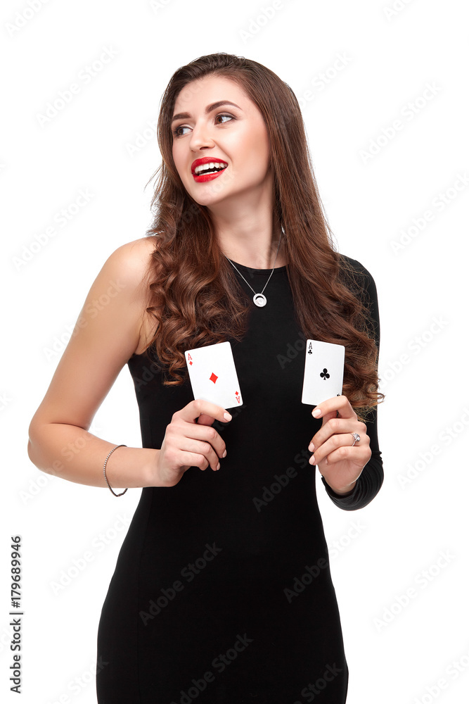 Sexy curly hair brunette posing with two aces cards in her hands, poker concept isolation on white background Sexy curly hair brunette posing with two aces cards in her hands, poker concept isolation on white background
