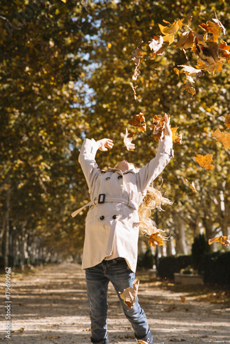 little girl with autumn leaves