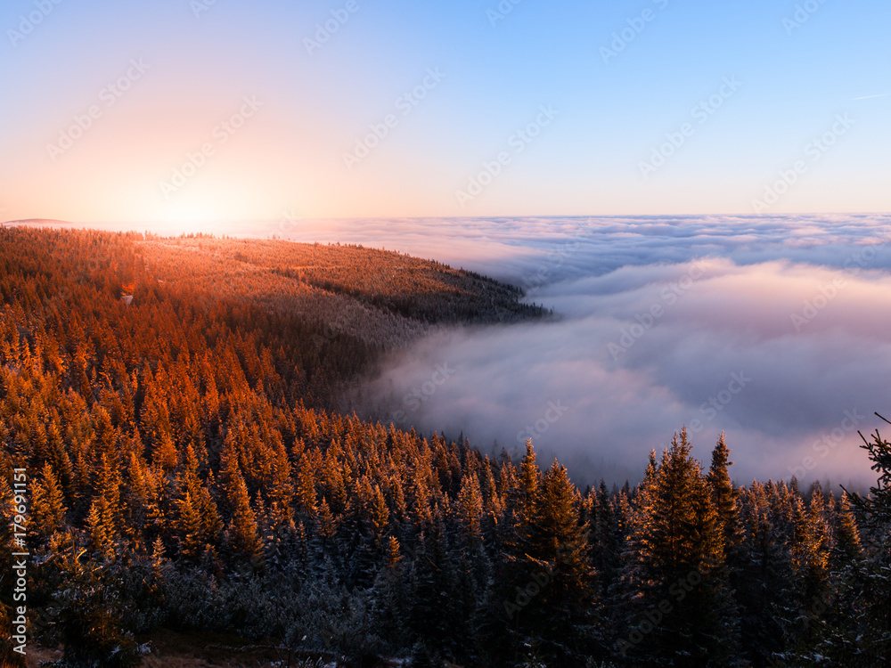 Mountain landscape at sunset time. Freezy evening and weather inversion, Giant Mountains, aka Krkonose, Czech Republic.