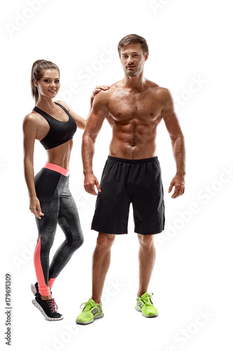 Sport  fitness  workout concept. Fit couple  strong muscular man and slim woman posing on a white background