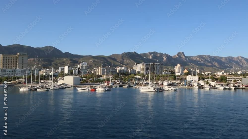 KYRENIA, NORTH CYPRUS - JULY 26, 2017: Panorama of Kyrenia (Girne) harbour in North Cyprus in a beautiful summer day KYRENIA, NORTH CYPRUS - JULY 26, 2017: Panorama of Kyrenia (Girne) harbour in North Cyprus in a beautiful summer day