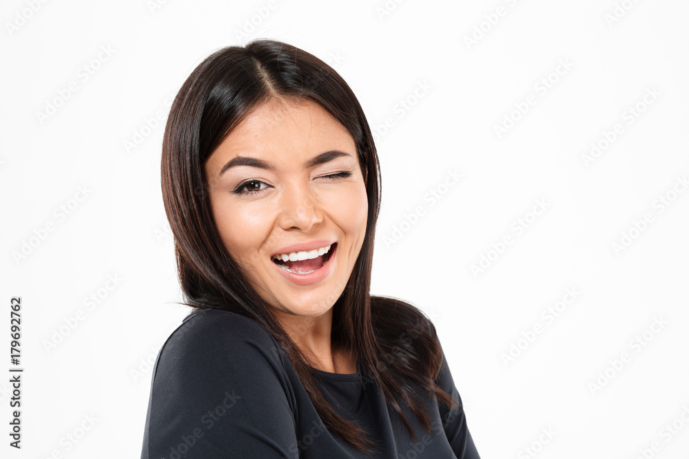 Happy young asian lady standing isolated over Happy young asian lady standing isolated over